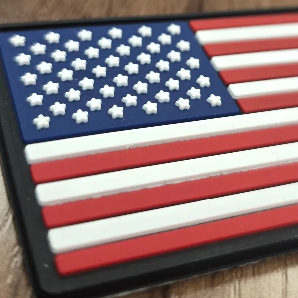 Close-up of a PVC tech patch of an American flag with raised stars and stripes