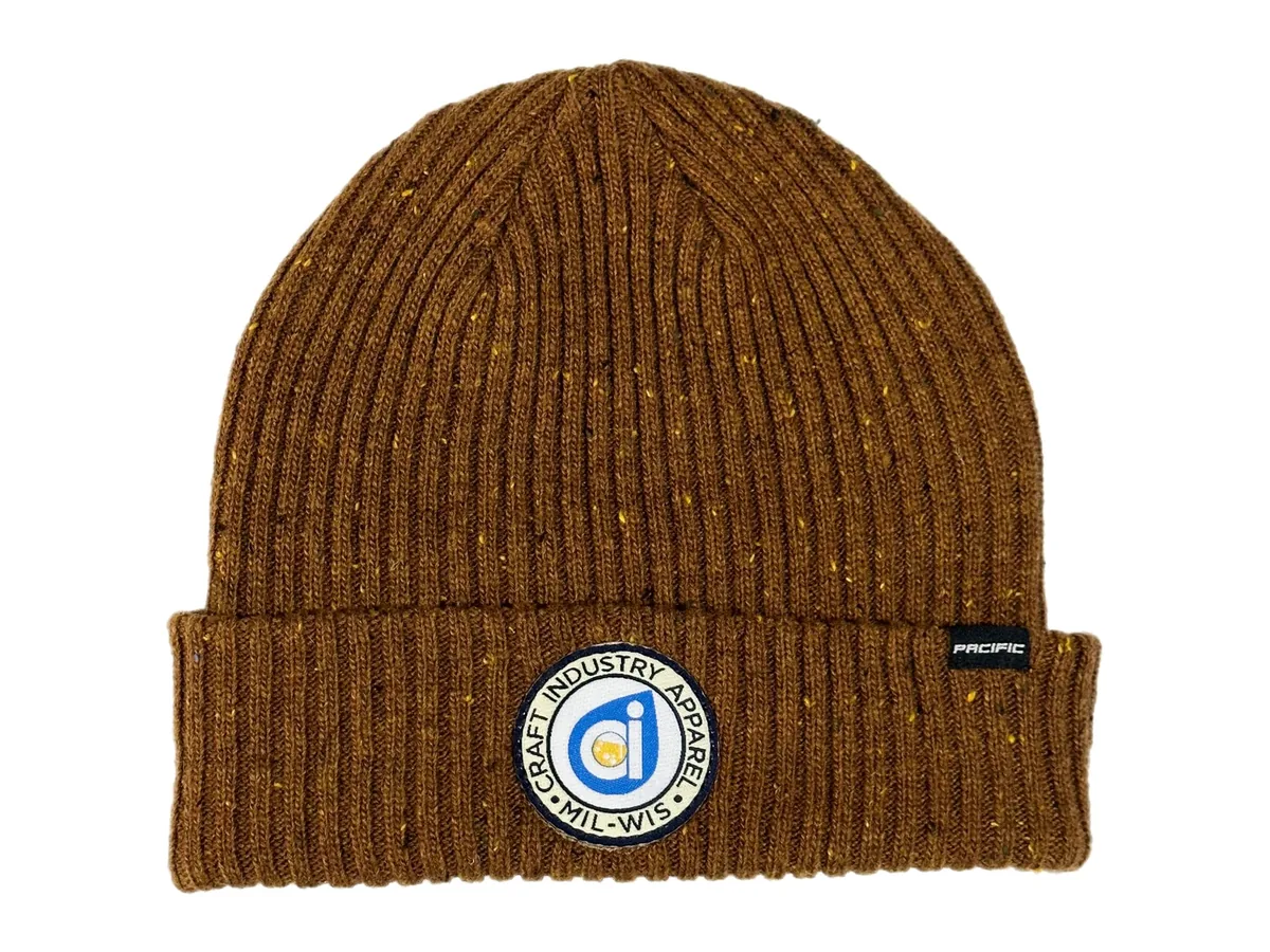 Brown cuffed knit beanie with a round Craft Industry Apparel woven patch