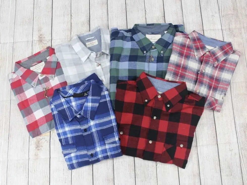 Assorted plaid flannel shirts ready for custom decoration